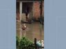 Bebê é resgatado por vizinho durante temporal e imagens viralizam na internet
