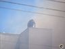 Bombeiros trabalham no rescaldo do incêndio no Super Vipi Center