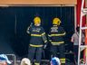 Bombeiros trabalham no rescaldo do incêndio no Super Vipi Center