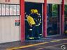 Bombeiros trabalham no rescaldo do incêndio no Super Vipi Center